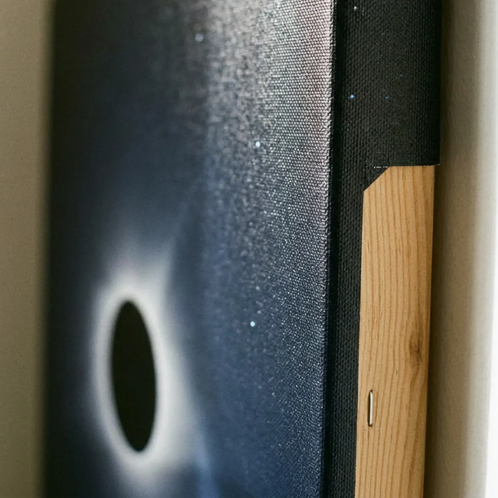 Corner of a gallery-wrapped canvas print showing texture and deep wrap