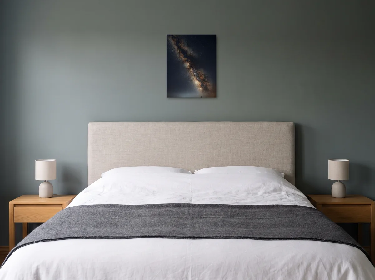 Galactic Core as a 40x50 cm canvas on a sage-grey bedroom wall above an upholstered headboard
