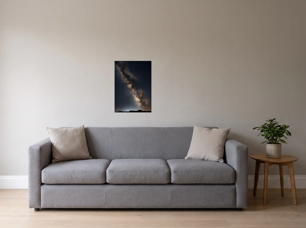 Galactic Core as a 50x70 cm poster on a light grey wall above a grey sofa