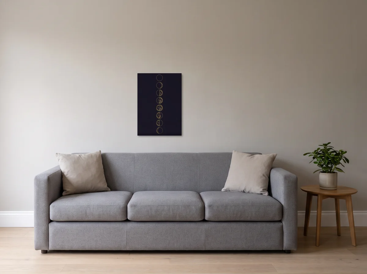 Lunar Phases as a 50x70 cm canvas on a light grey wall above a grey sofa