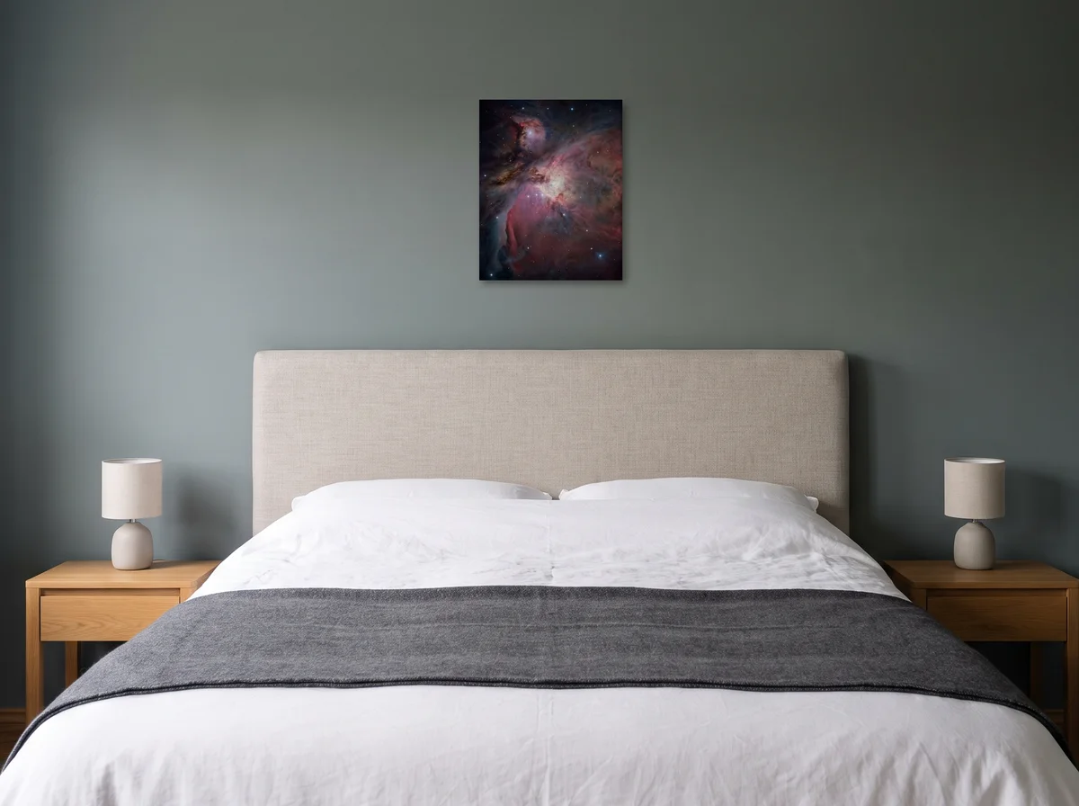 Orion Cradle as a 40 x 50 cm canvas on a sage-grey bedroom wall above an upholstered headboard.