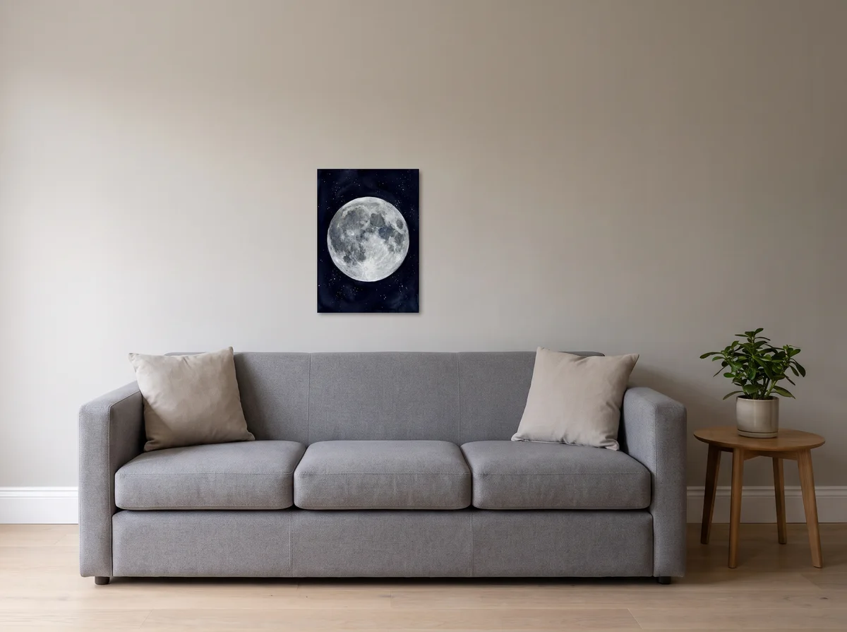 Watercolour Moon as a 50x70 cm canvas on a light grey wall above a grey sofa